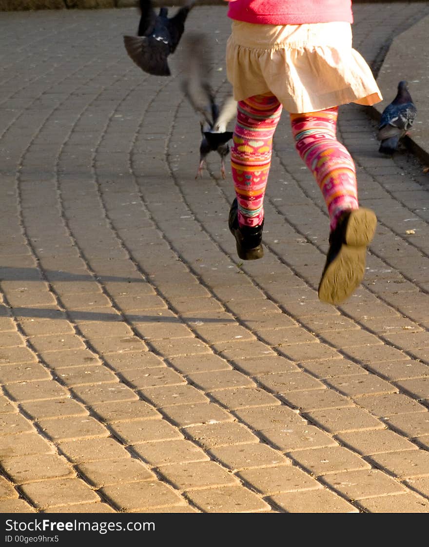 Girl playind with dove