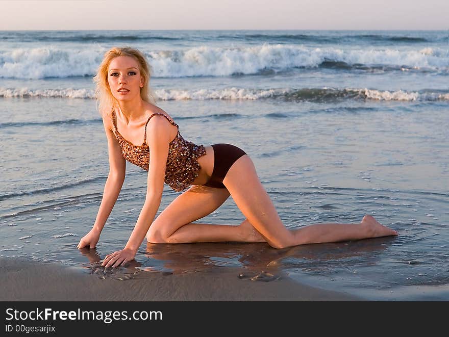 A girl on the beach in a bikini. A girl on the beach in a bikini