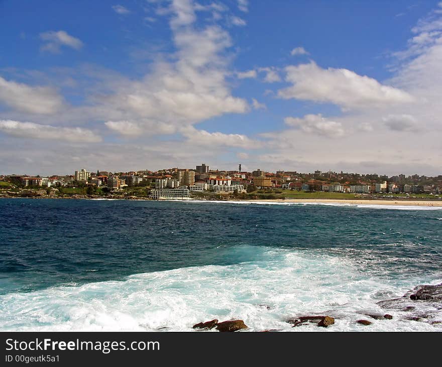 Overlooking the city and surf on a beautiful sunny summer day at Bondi Beach, Sydney, New South Wales (NSW), Australia. Overlooking the city and surf on a beautiful sunny summer day at Bondi Beach, Sydney, New South Wales (NSW), Australia