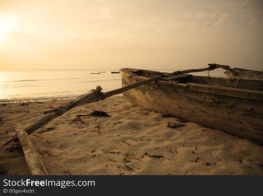 Hand built catamaran on the beach at sunrise Mombasa Kenya