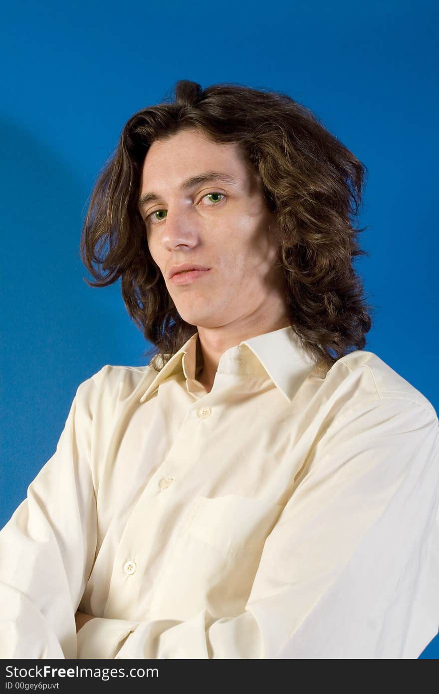 Young man in pale yellow shirt portrait