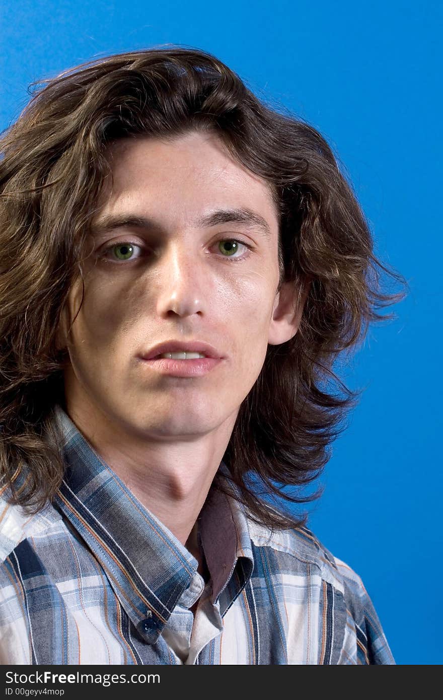 Simple portrait of young man with long hair. Simple portrait of young man with long hair