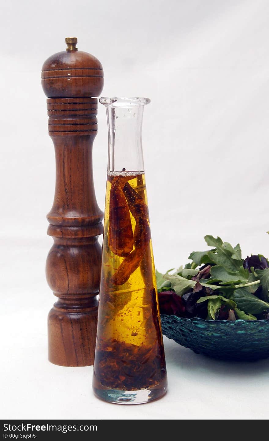 Oil and pepper and a healthy salad. Oil and pepper and a healthy salad