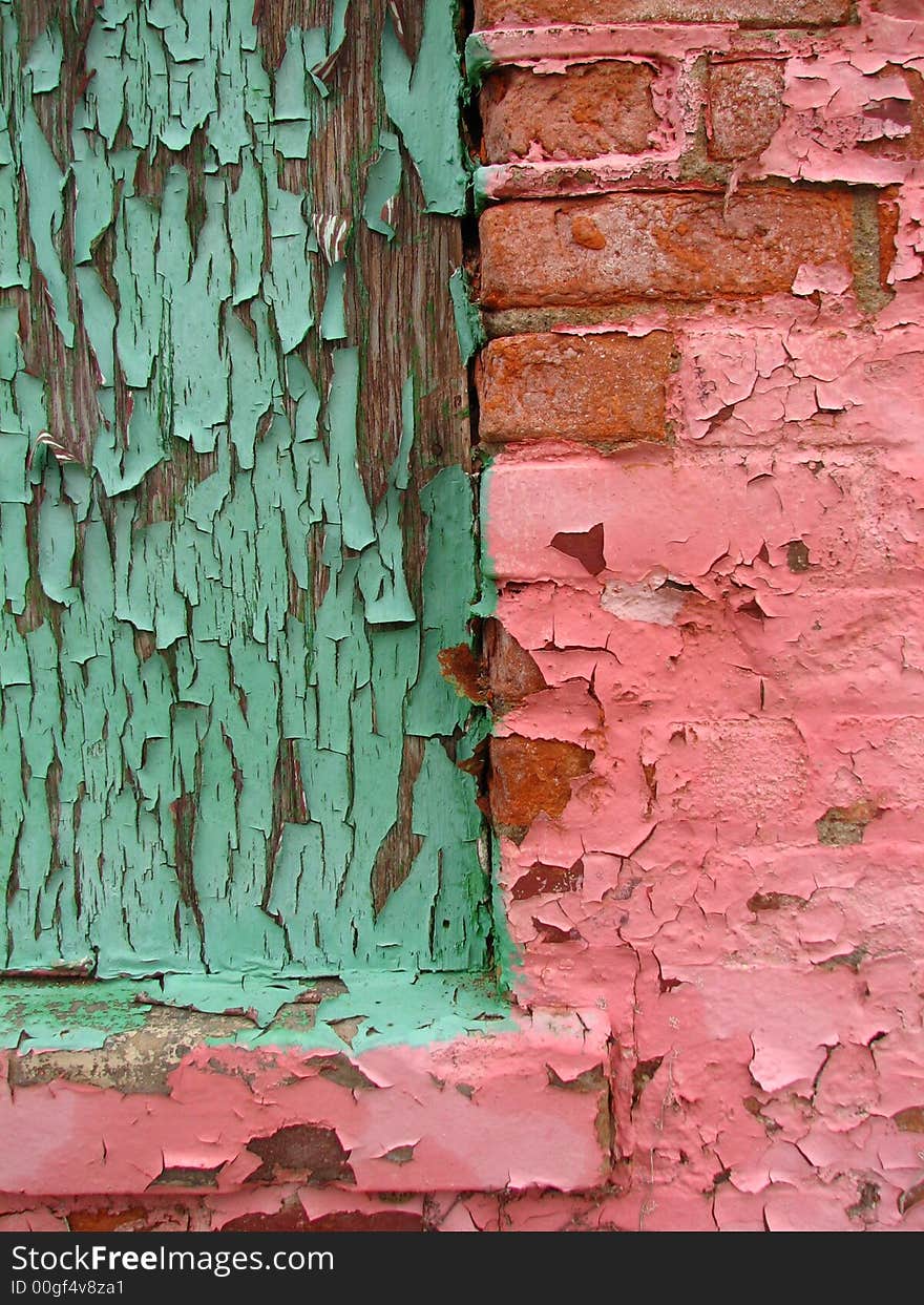 A close-up of the windowsill of an abandoned, pink building in downtown Toledo, OH.