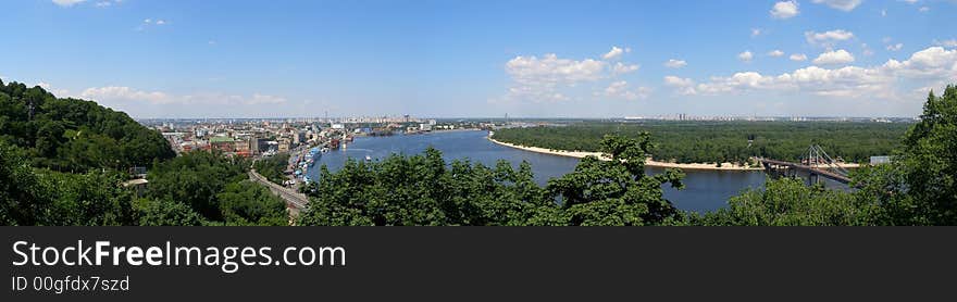 Panoramic sight of Kiev city bridge through river. Panoramic sight of Kiev city bridge through river