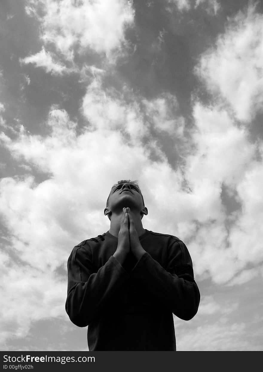 The boy stands on a sky background. The boy stands on a sky background