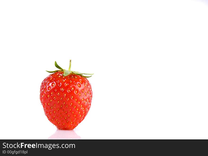 Strawberry isolated over white with reflection