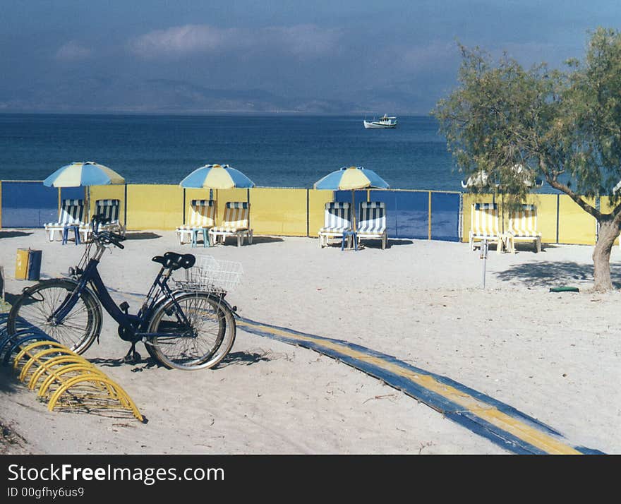 Bicycles parked on a sun drenched beach. Bicycles parked on a sun drenched beach