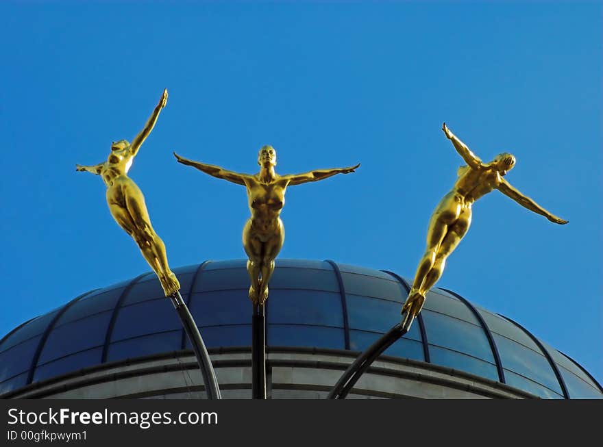 A modern statue of golden divers