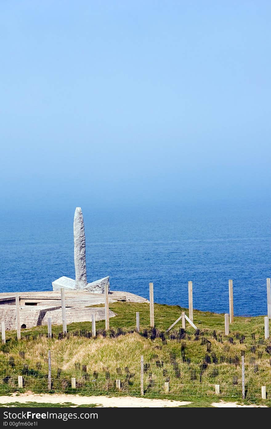 Monument to the Army Rangers at Pointe-Du-Hoc, Normandy, France with a blue sky background. Monument to the Army Rangers at Pointe-Du-Hoc, Normandy, France with a blue sky background