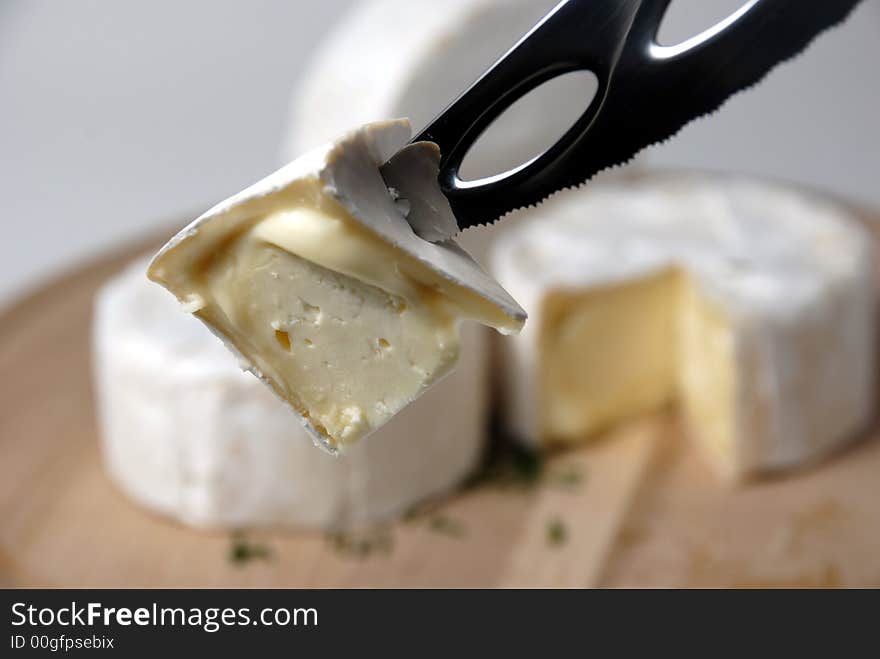 Arrangement with cheese and knife. Arrangement with cheese and knife