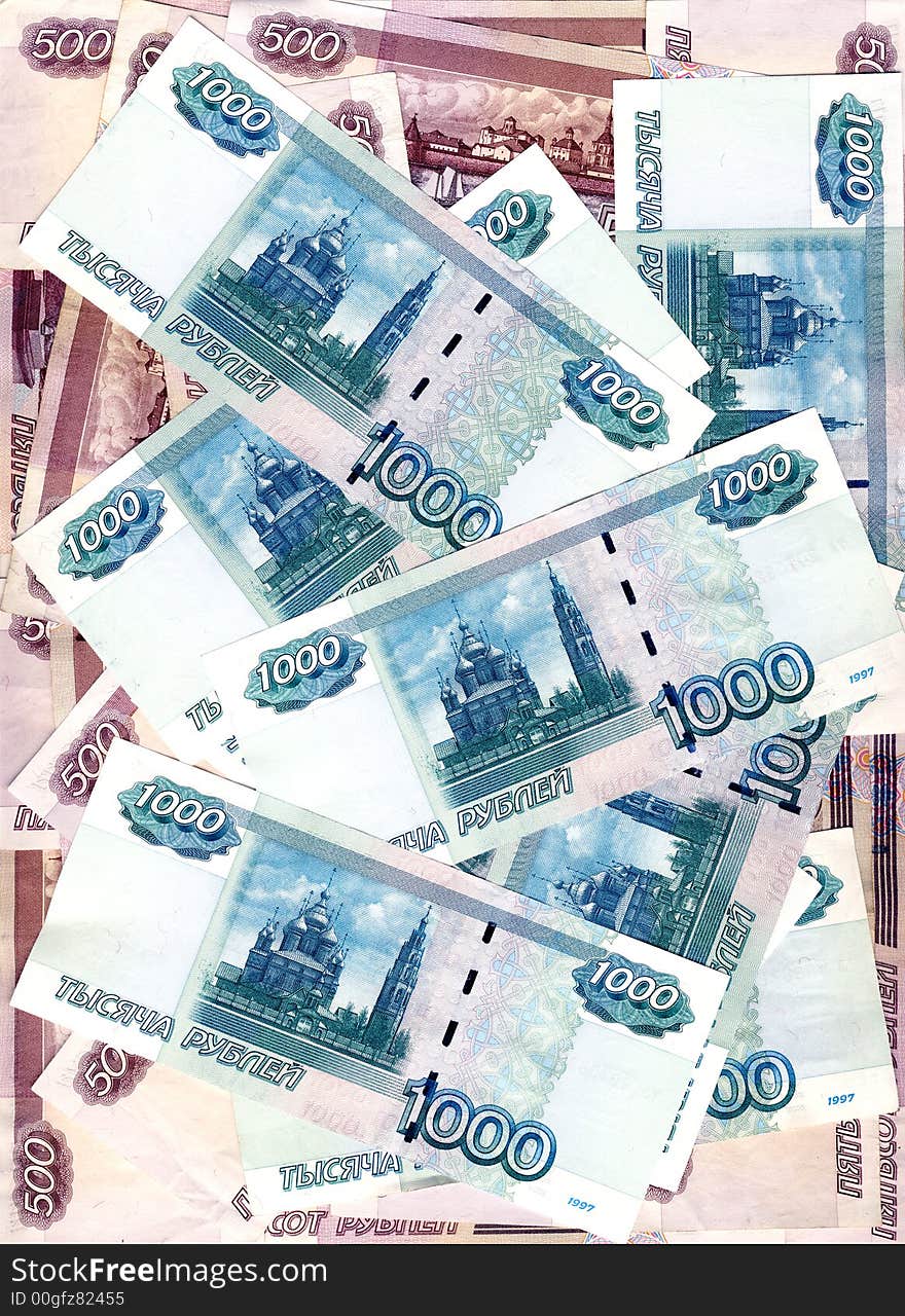 Some denominations of denomination in five hundred and one thousand roubles Russia laying in the any order, forming a background