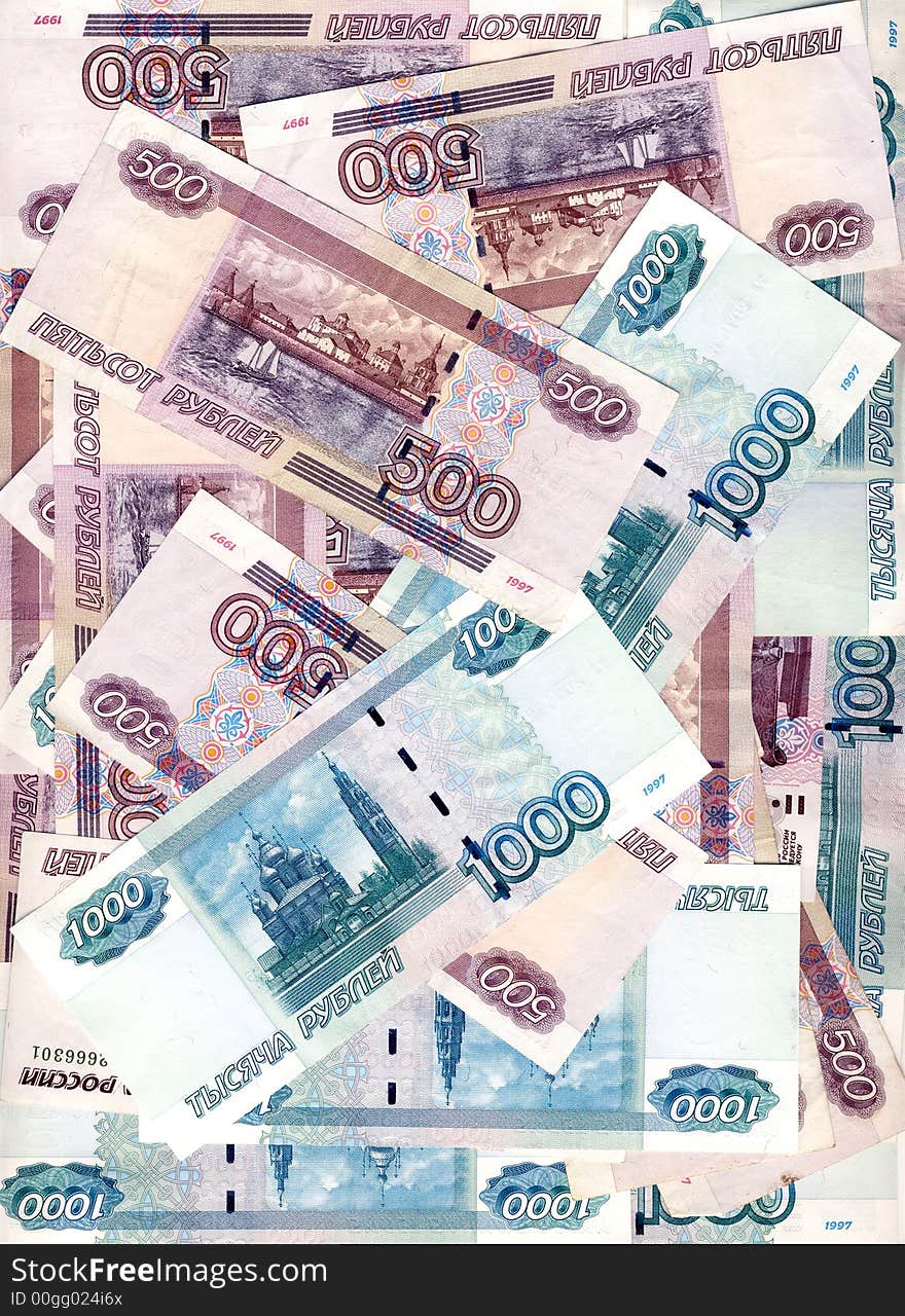 Some denominations of denomination in five hundred and one thousand roubles Russia laying in the any order, forming a background. Some denominations of denomination in five hundred and one thousand roubles Russia laying in the any order, forming a background