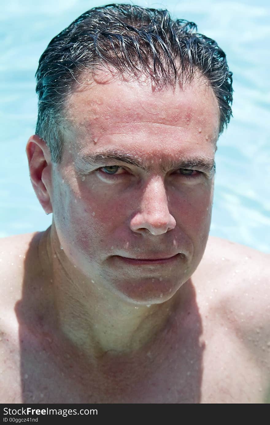 Portrait of a man in a swimming pool. Portrait of a man in a swimming pool.