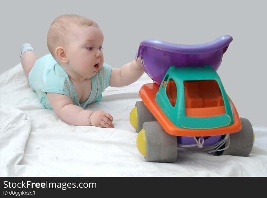 A child playing with toy-lorry