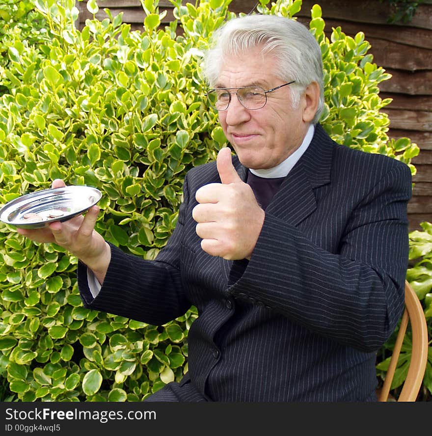 Vicar passing the plate for you to put in. Vicar passing the plate for you to put in.