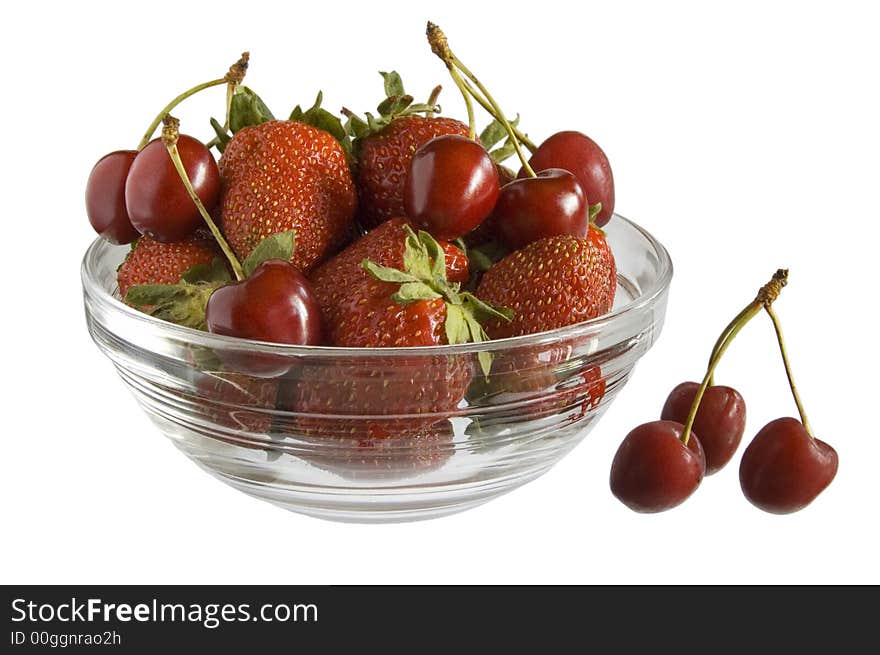 Strawberries and cherries in bowl on white