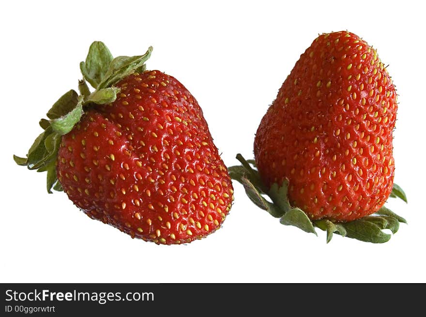 Close-up of two strawberries on white