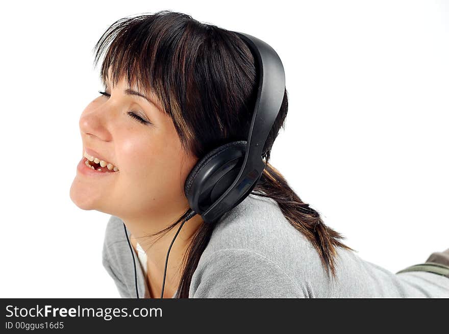 Attractive woman with headphones isolated on white background. Attractive woman with headphones isolated on white background