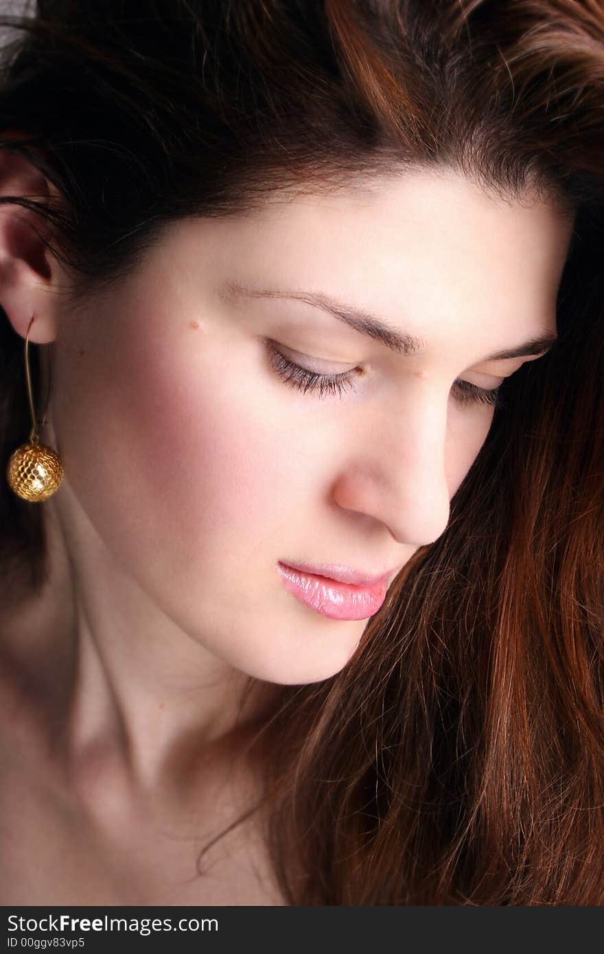 Glamour portrait of beautiful woman on a grey background. Glamour portrait of beautiful woman on a grey background