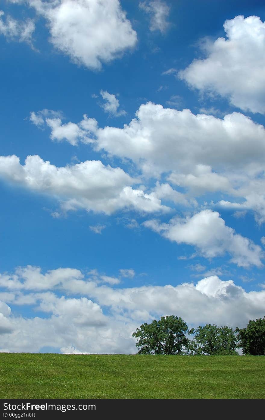 Landscape with clouds and tree