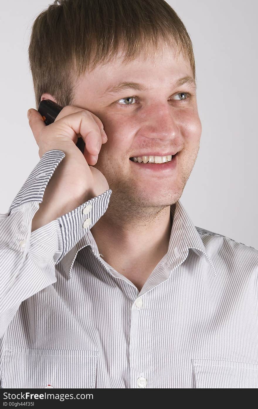 Young businessman talking on the cell phone