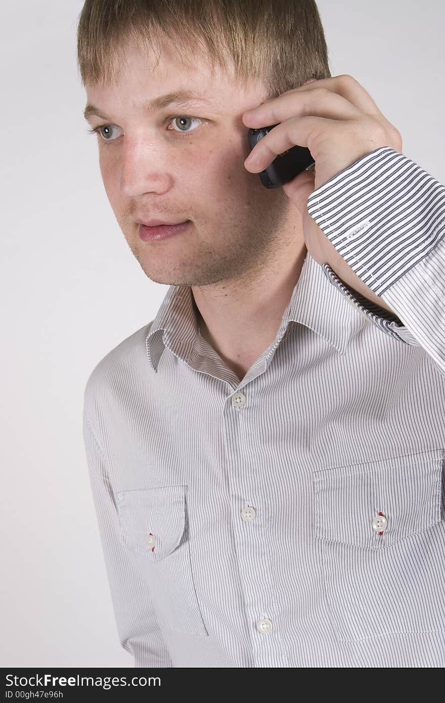 Young businessman talking on cellphone