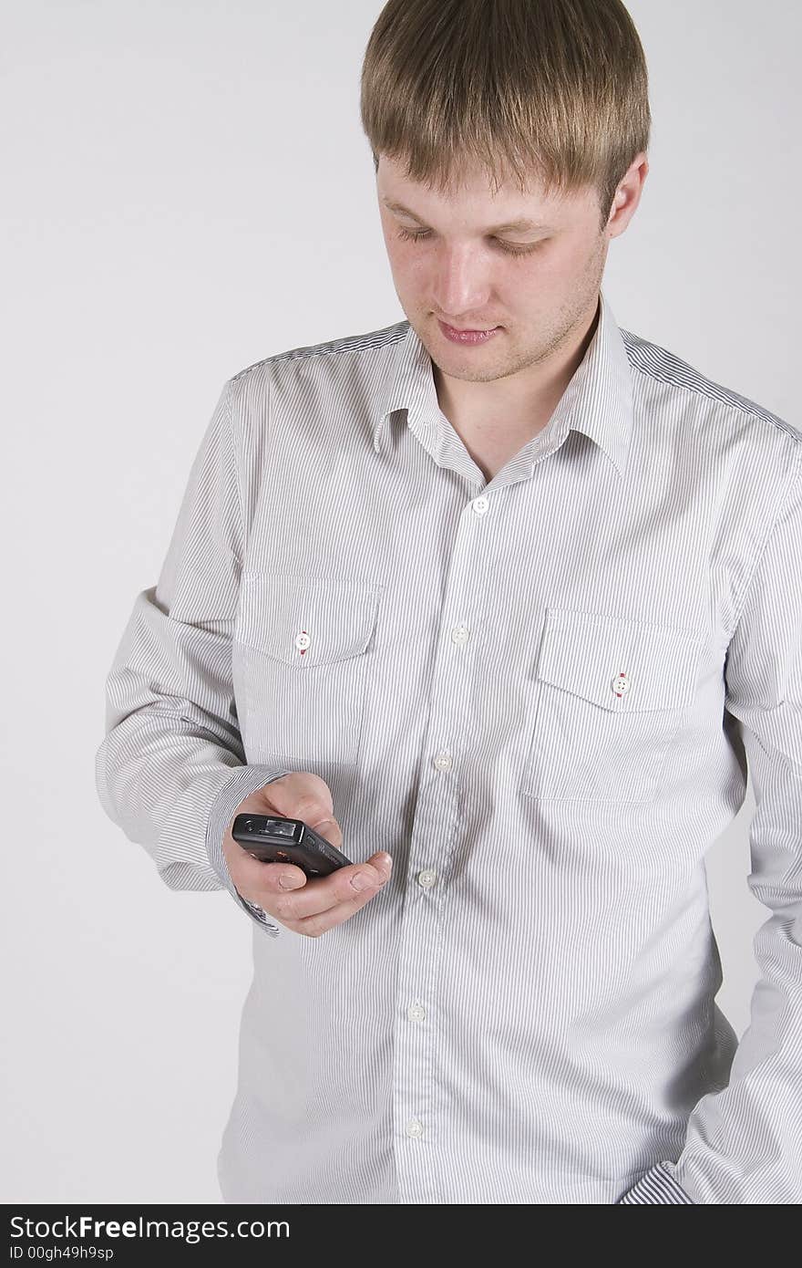 Young businessman and black cellphone