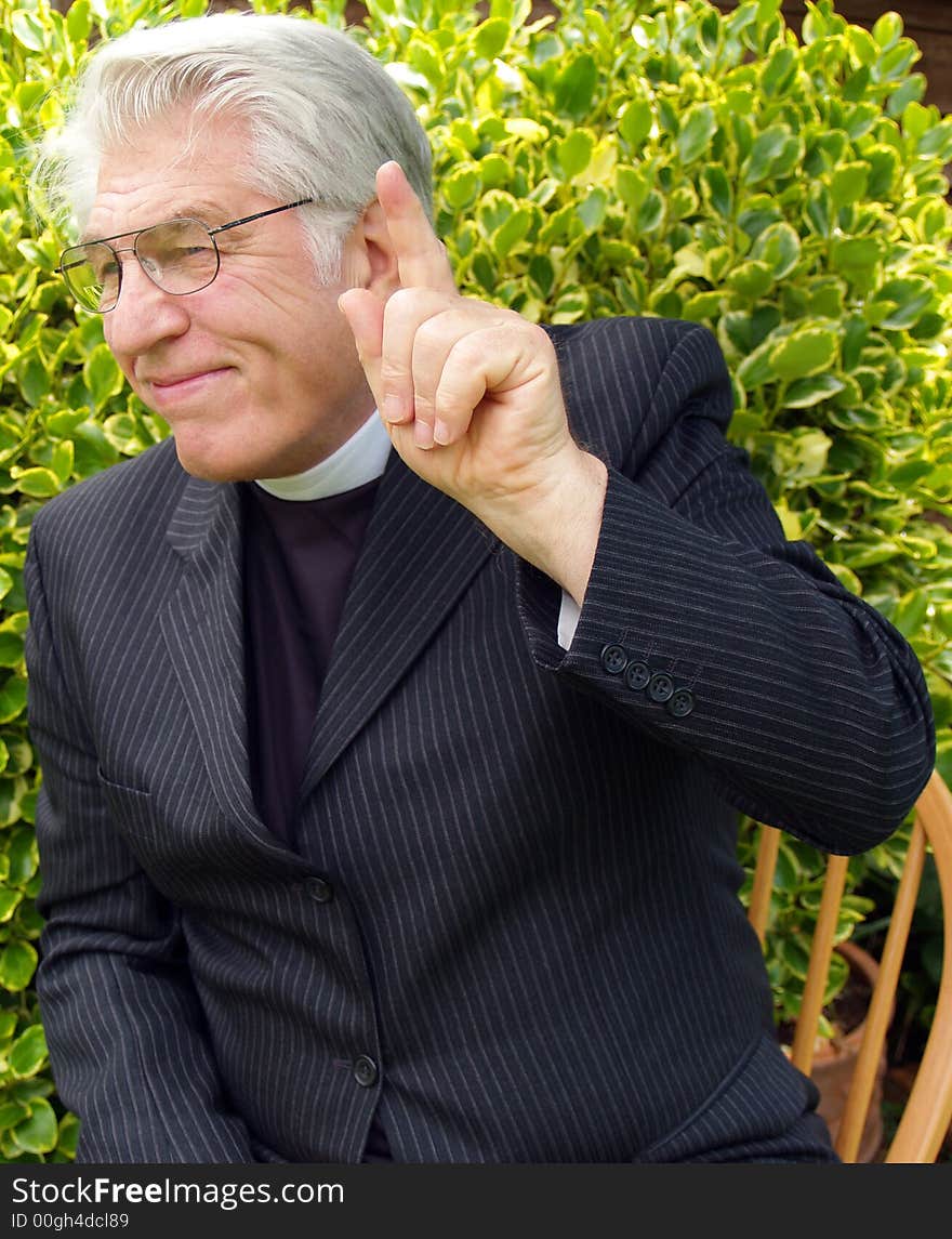 Vicar giving a sermon in the garden