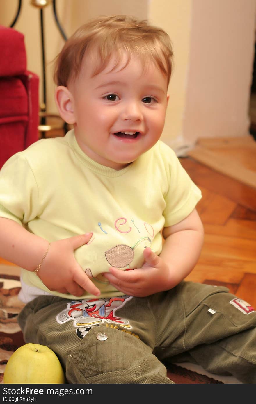 Expressive blond baby boy smiling. Expressive blond baby boy smiling