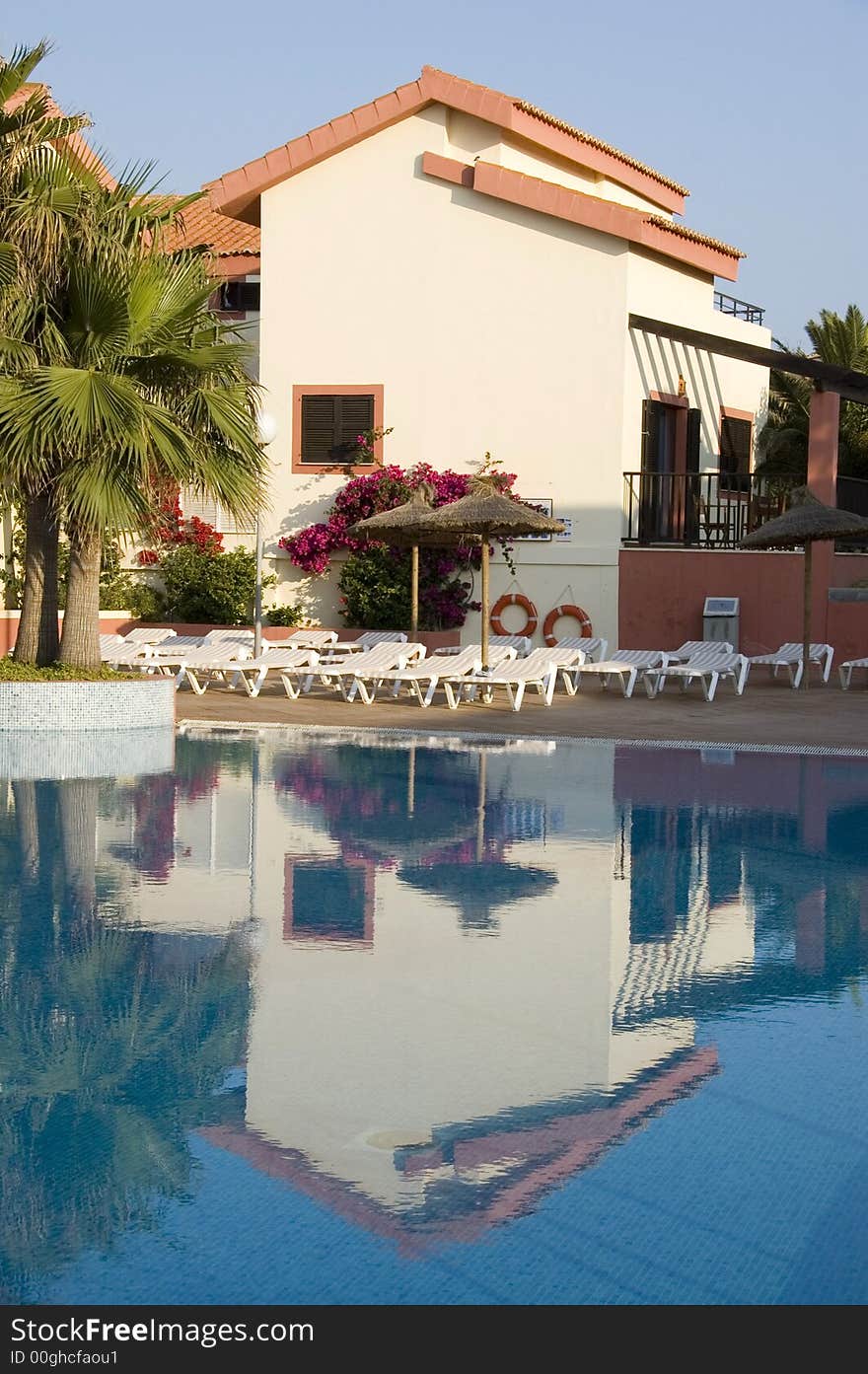 Reflection of a vacation apartment in a swimming pool. Reflection of a vacation apartment in a swimming pool