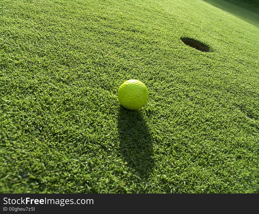 Yellow golf's ball near the 18th hole