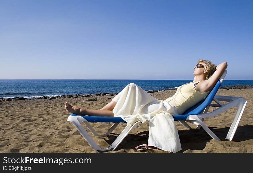 A woman resting on the beach