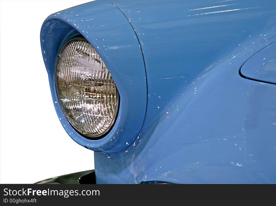 Close up of the front headlight of an old car. Close up of the front headlight of an old car