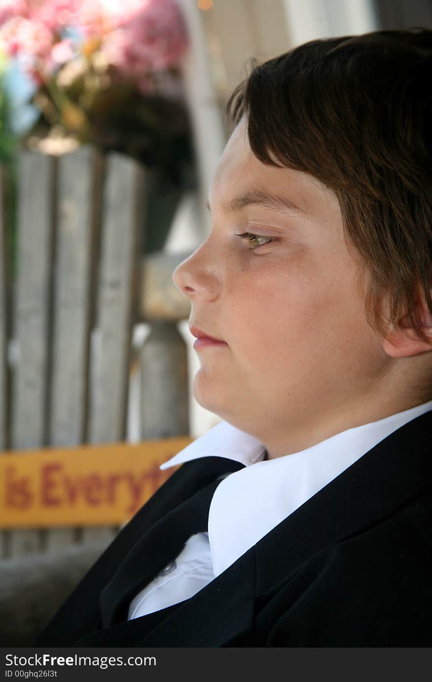 An adolescent boy sitting on a porch contemplating his teen years and life in general. An adolescent boy sitting on a porch contemplating his teen years and life in general