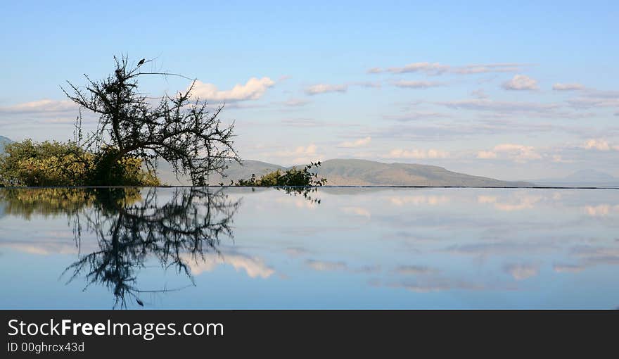 Sky reflecting in swimming pool Lake Manyara Tanzania. Sky reflecting in swimming pool Lake Manyara Tanzania