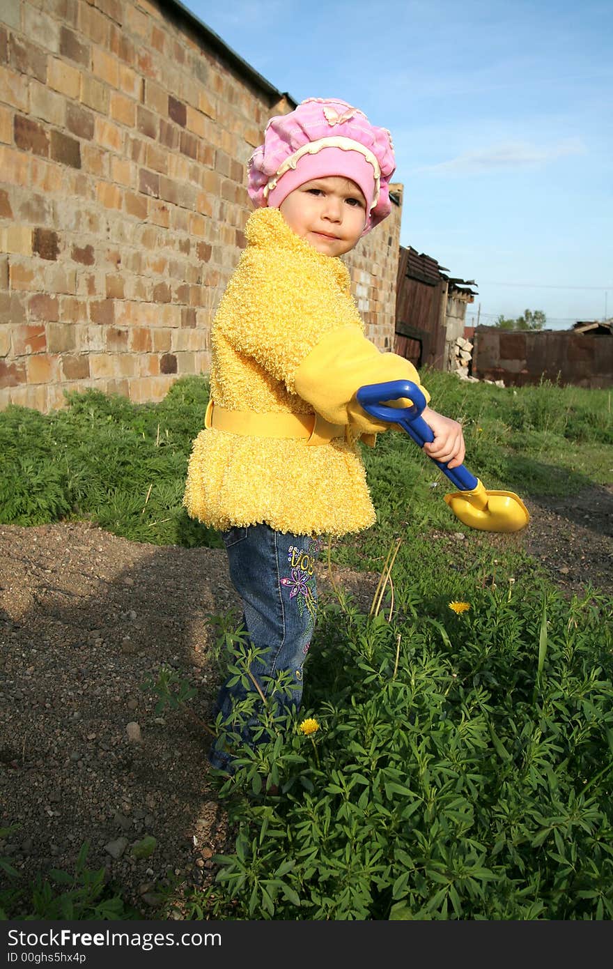 The little girl in a yellow jacket