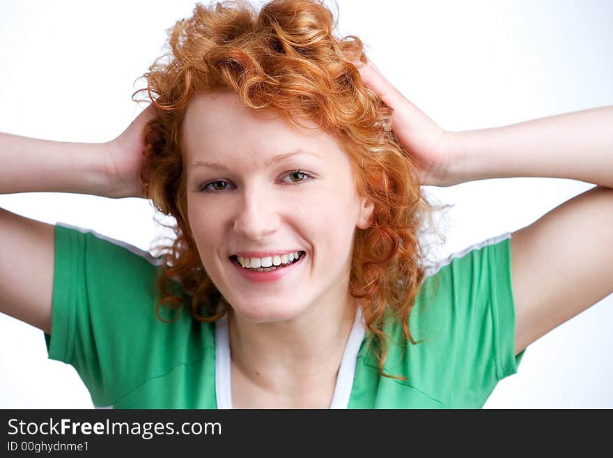 Beautiful young woman wearing a green shirt laughing. Beautiful young woman wearing a green shirt laughing