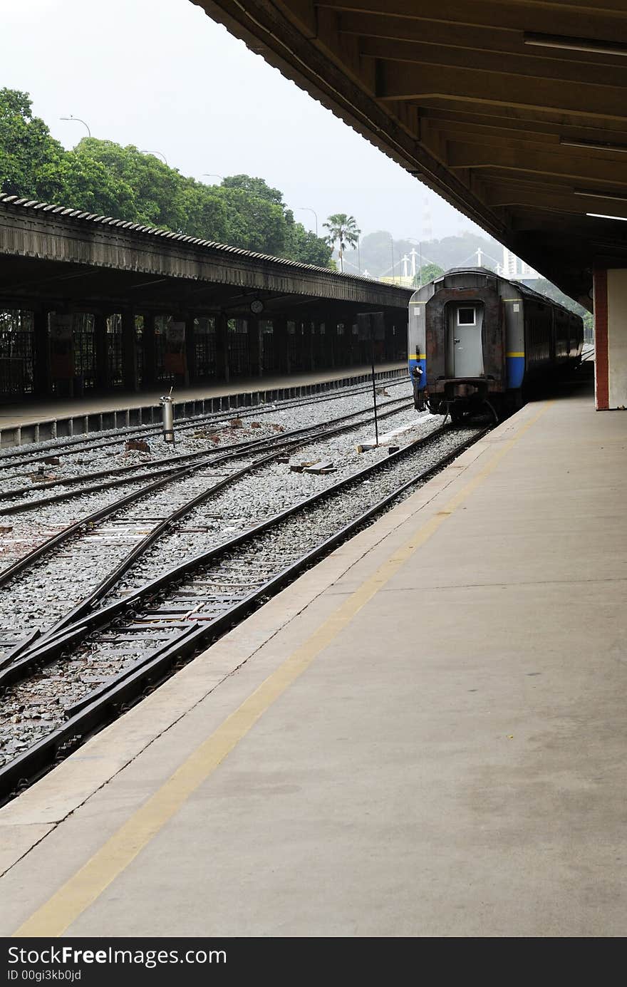 Empty railway station with stationary train