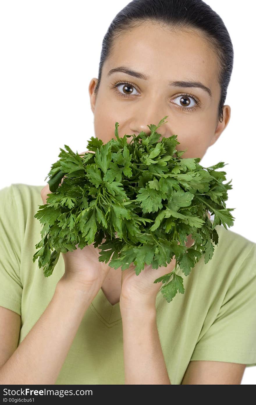 Girl eating parsley