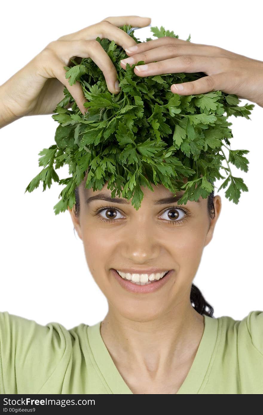 Pretty girl holding parsley on her head. Pretty girl holding parsley on her head