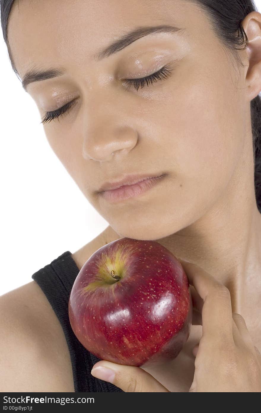 Smiling girl holding apple in her hand. Smiling girl holding apple in her hand