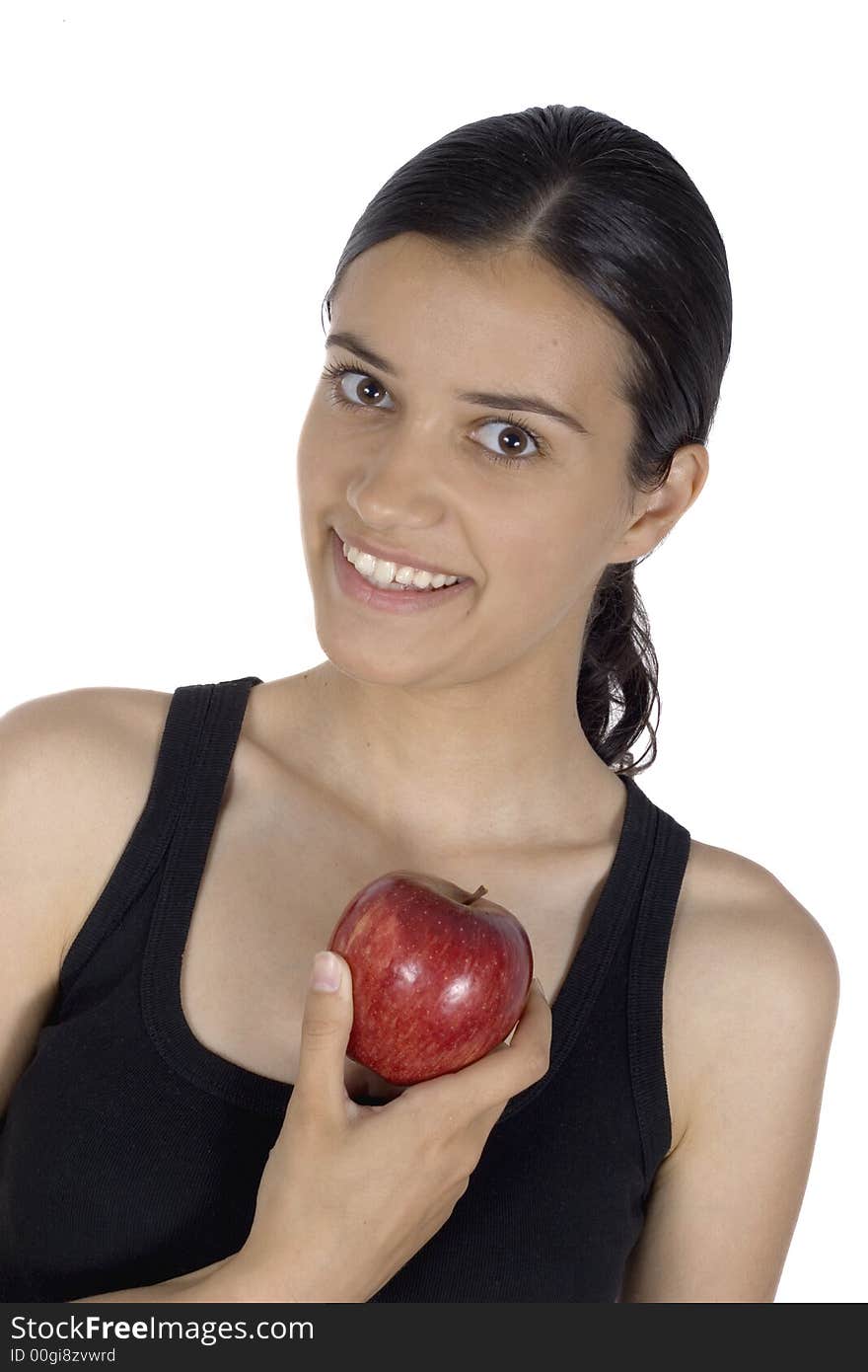 Smiling girl holding apple in her hand. Smiling girl holding apple in her hand