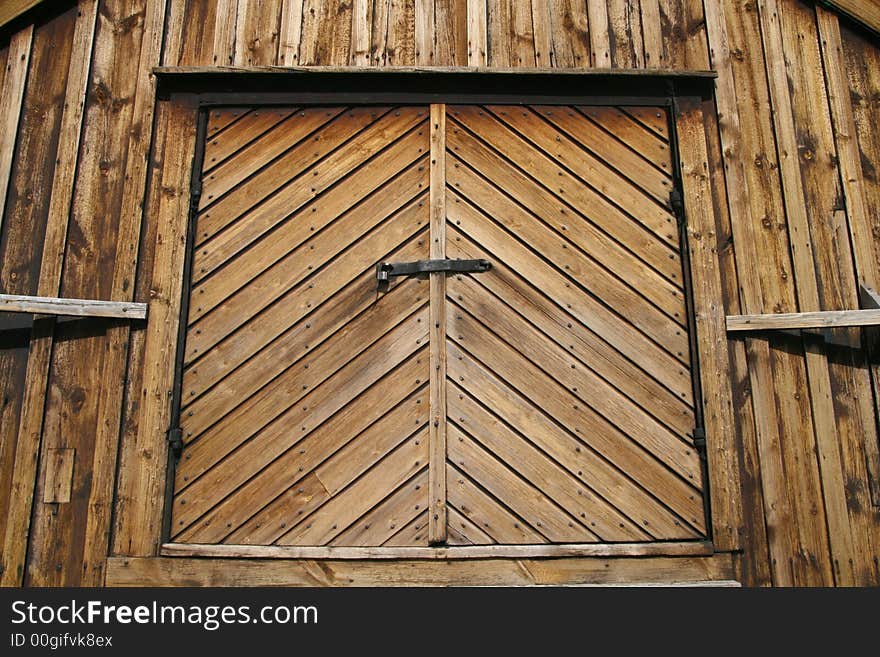 Ancient wooden gate with solid lock. Ancient wooden gate with solid lock