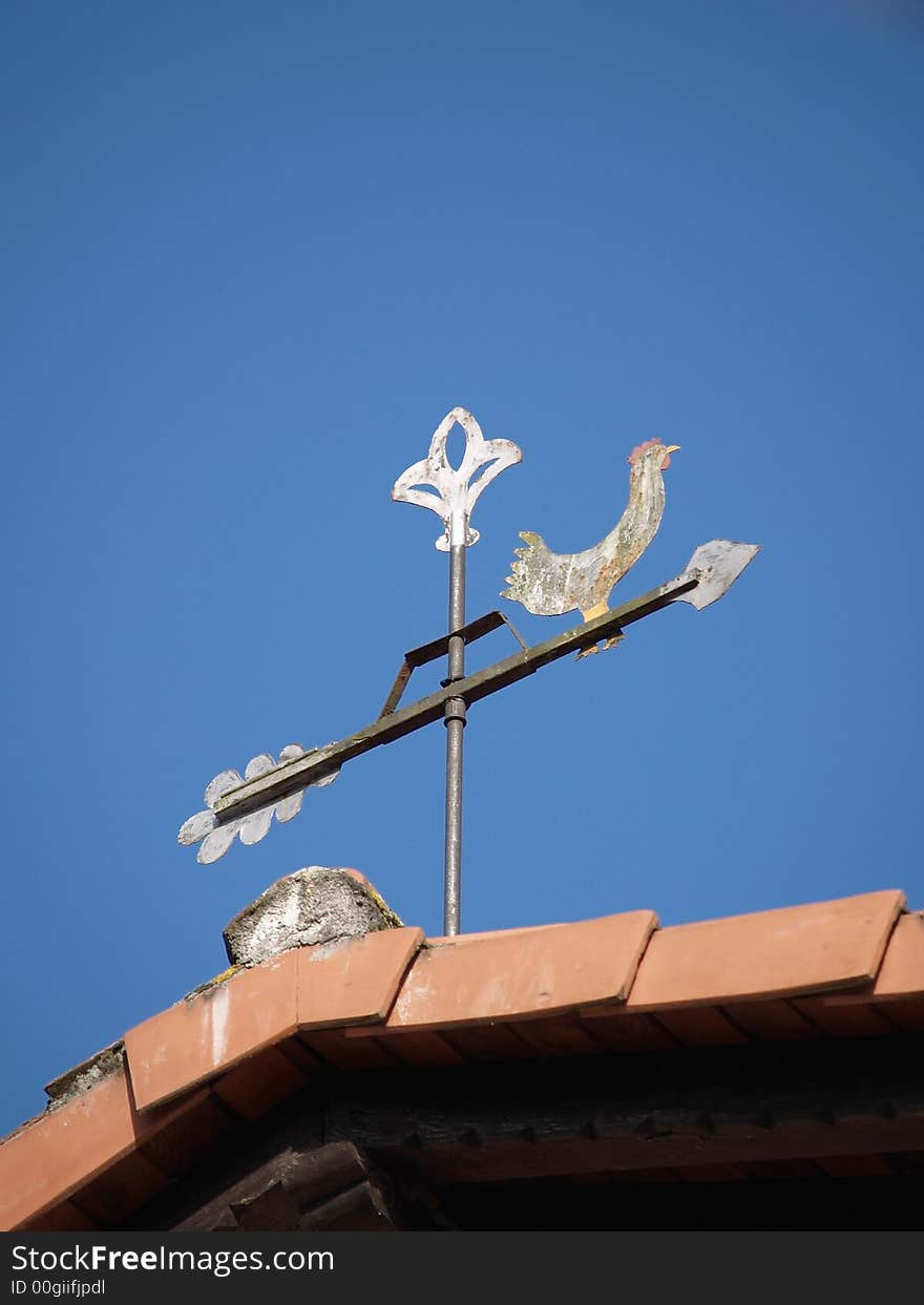 Weather Vane on blue background