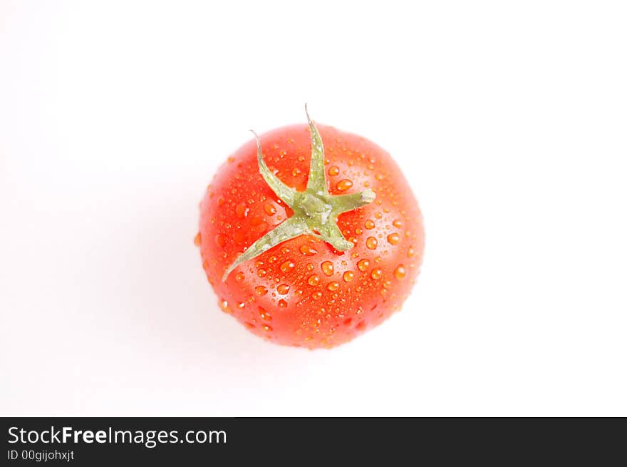 Proud red tomato on the bright background