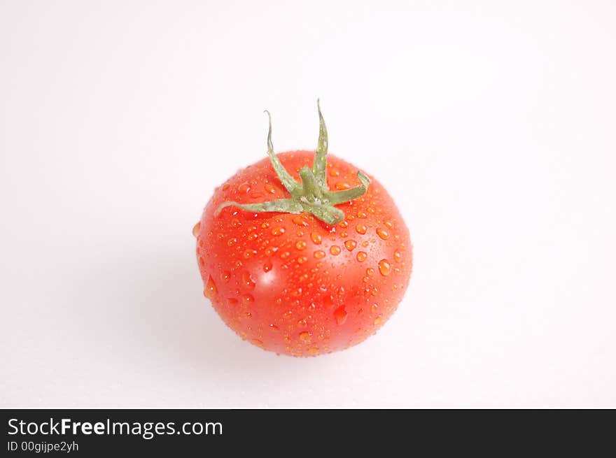 Proud red tomato on the bright background