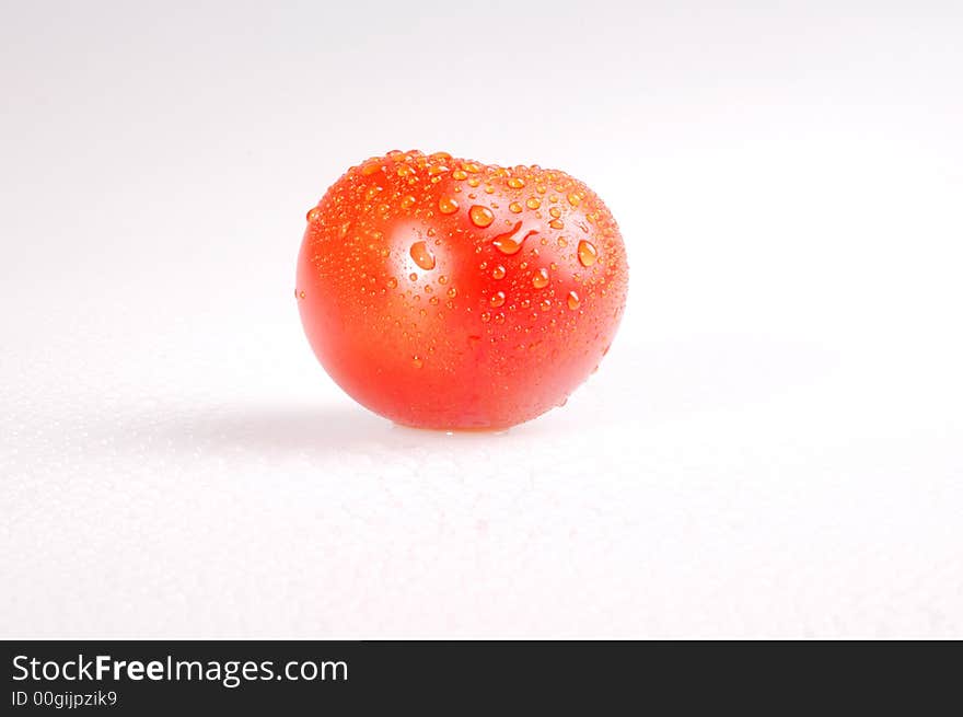 Proud red tomato on the bright background