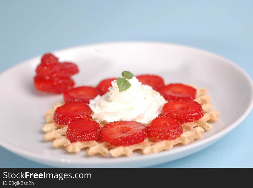 Strawberries on the blue background. Strawberries on the blue background