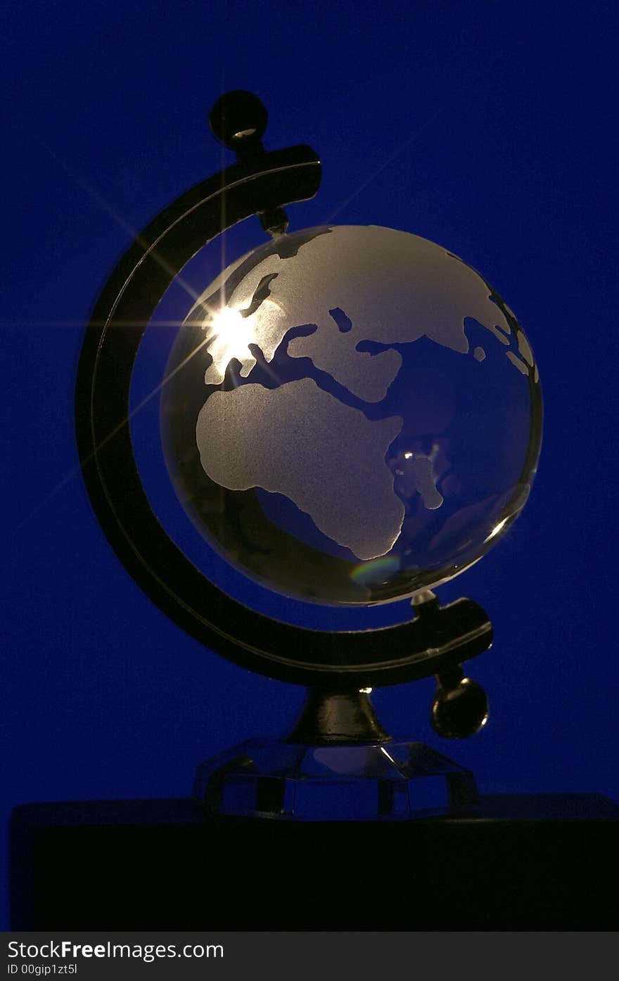 Glass globe on a blue background